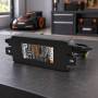 WORX WA3744 28V power supply adapter on a workbench in a garage