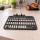 Black perforated plastic size S plate on workbench for robotic lawn mower accessory
