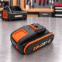 Batterie au lithium Worx WA3639 20 V 2 Ah sur établi, chargeur en arrière-plan